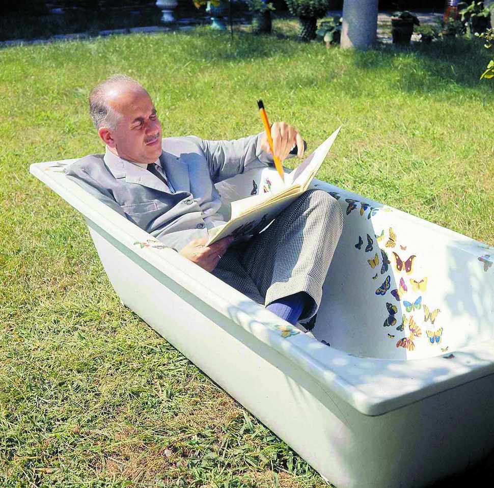 Piero Fornasetti drawing in his bathtub. Courtesy Fornasetti.